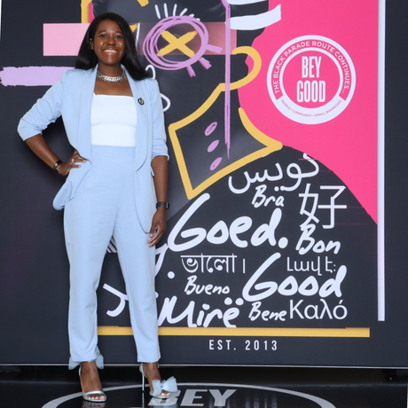 (Click to read) ICONI's CEO, Angel, standing in front of a BeyGood backdrop