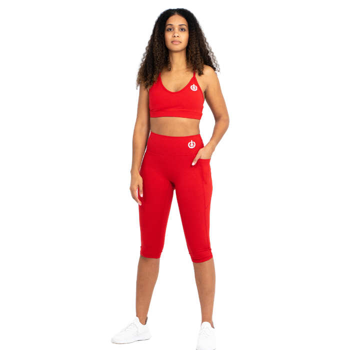 Model Alex in ICONI red sports bra and red cropped legging