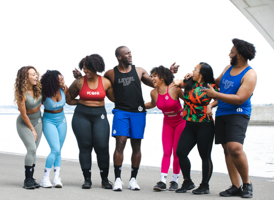 Photos of 7 ICONI Models (Men and Women) laughing together in a group photo